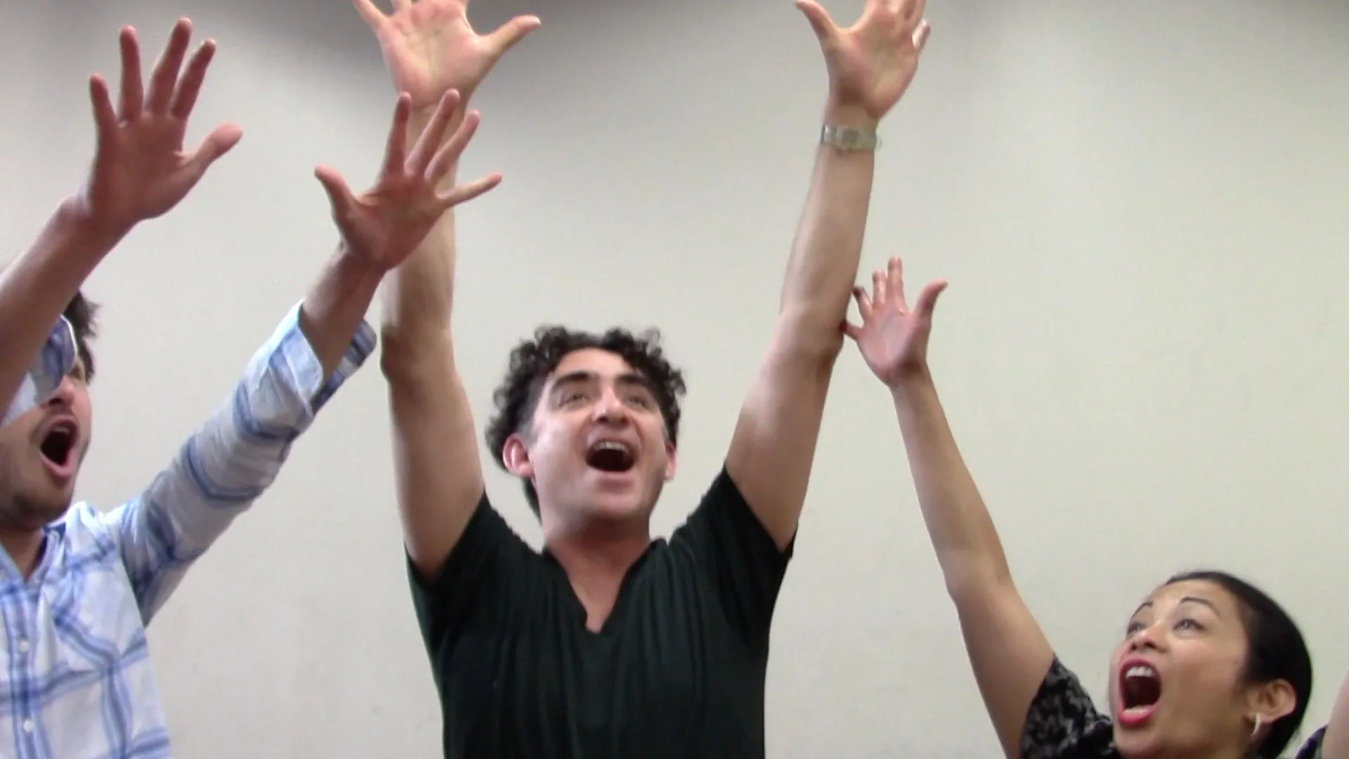 A man with his hands up in the air.