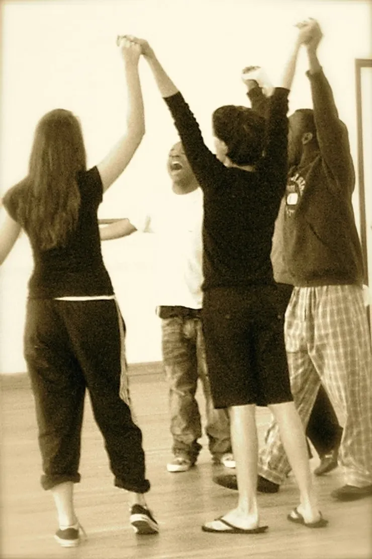 A group of people standing around each other.
